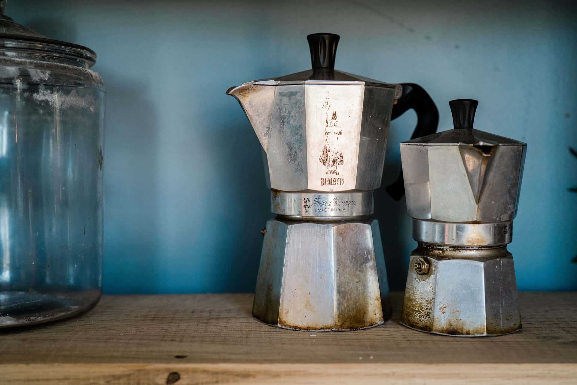 Two metal pots photographed side by side