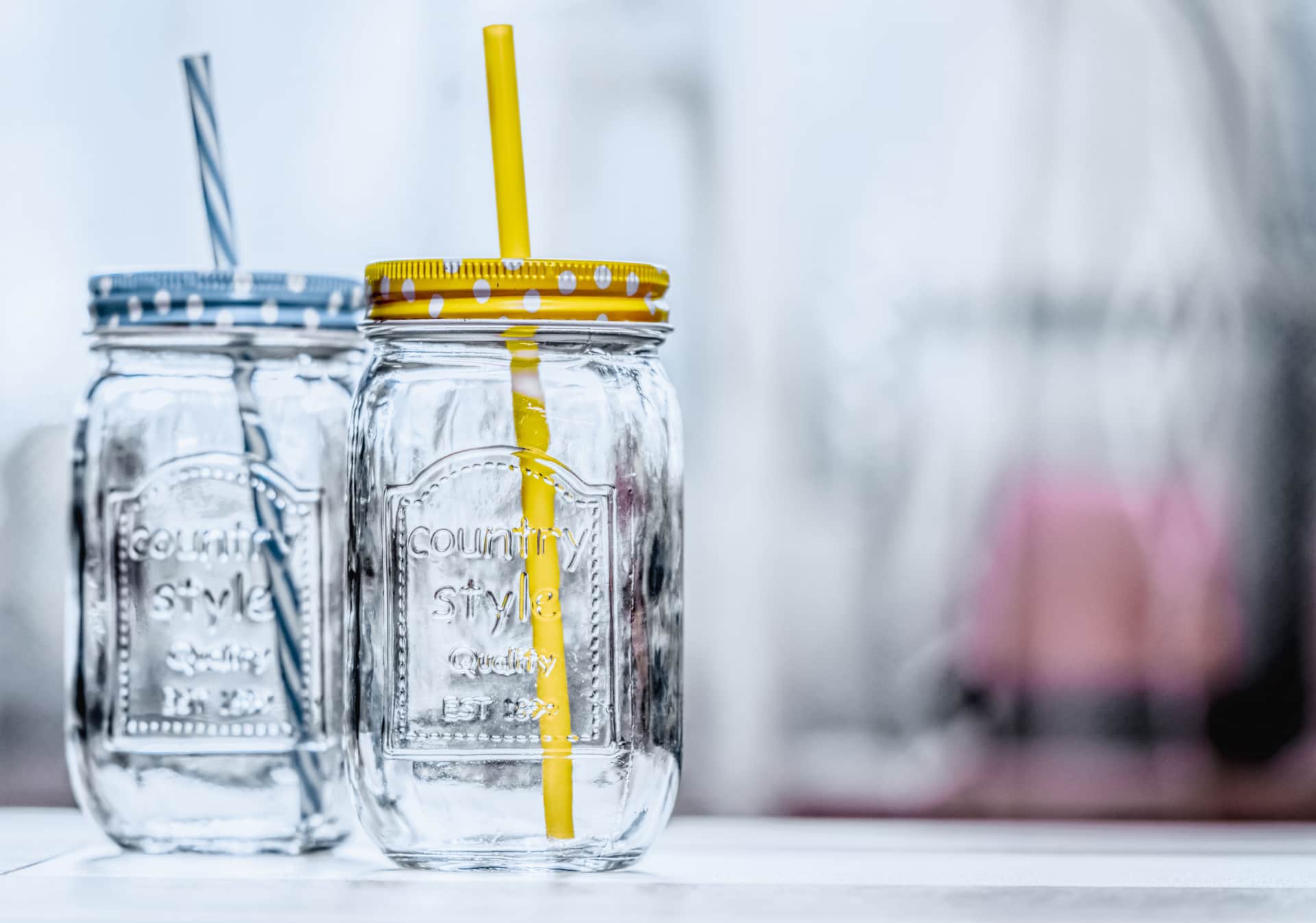 Two clear glass jars side by side