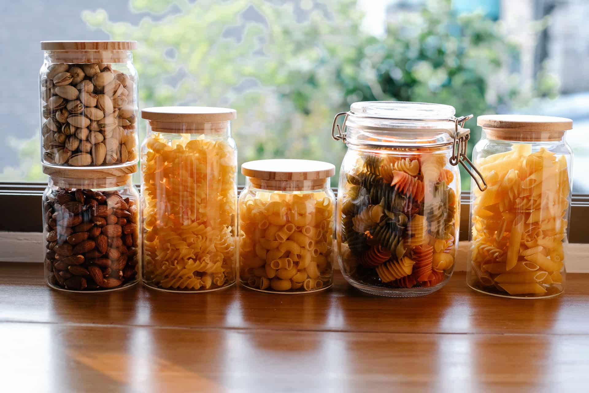 Glass jars of different sizes in a row