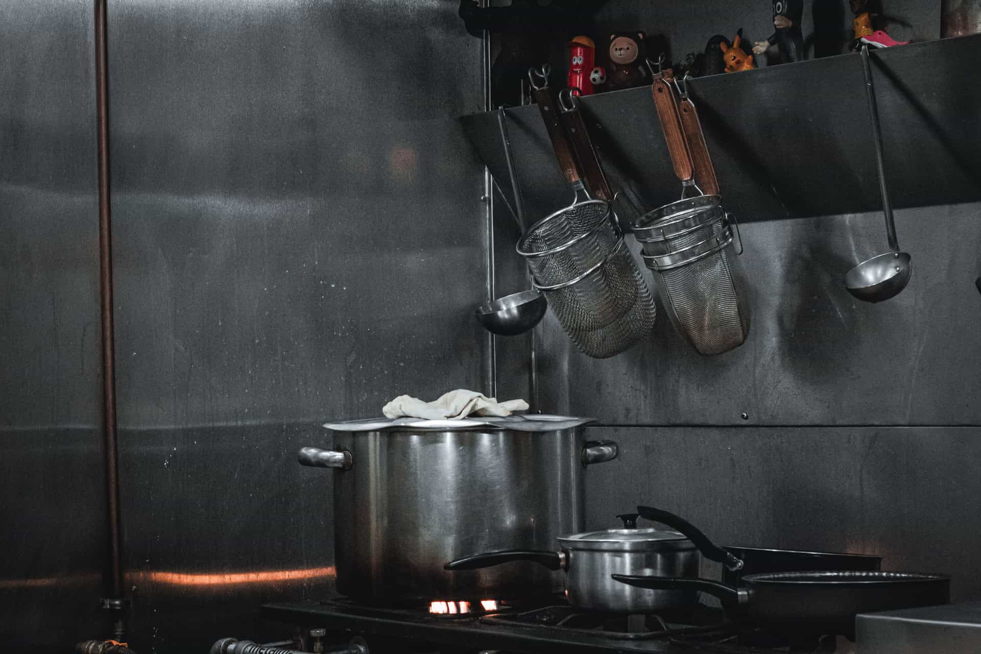 Stainless steel pots in a commercial kitchen