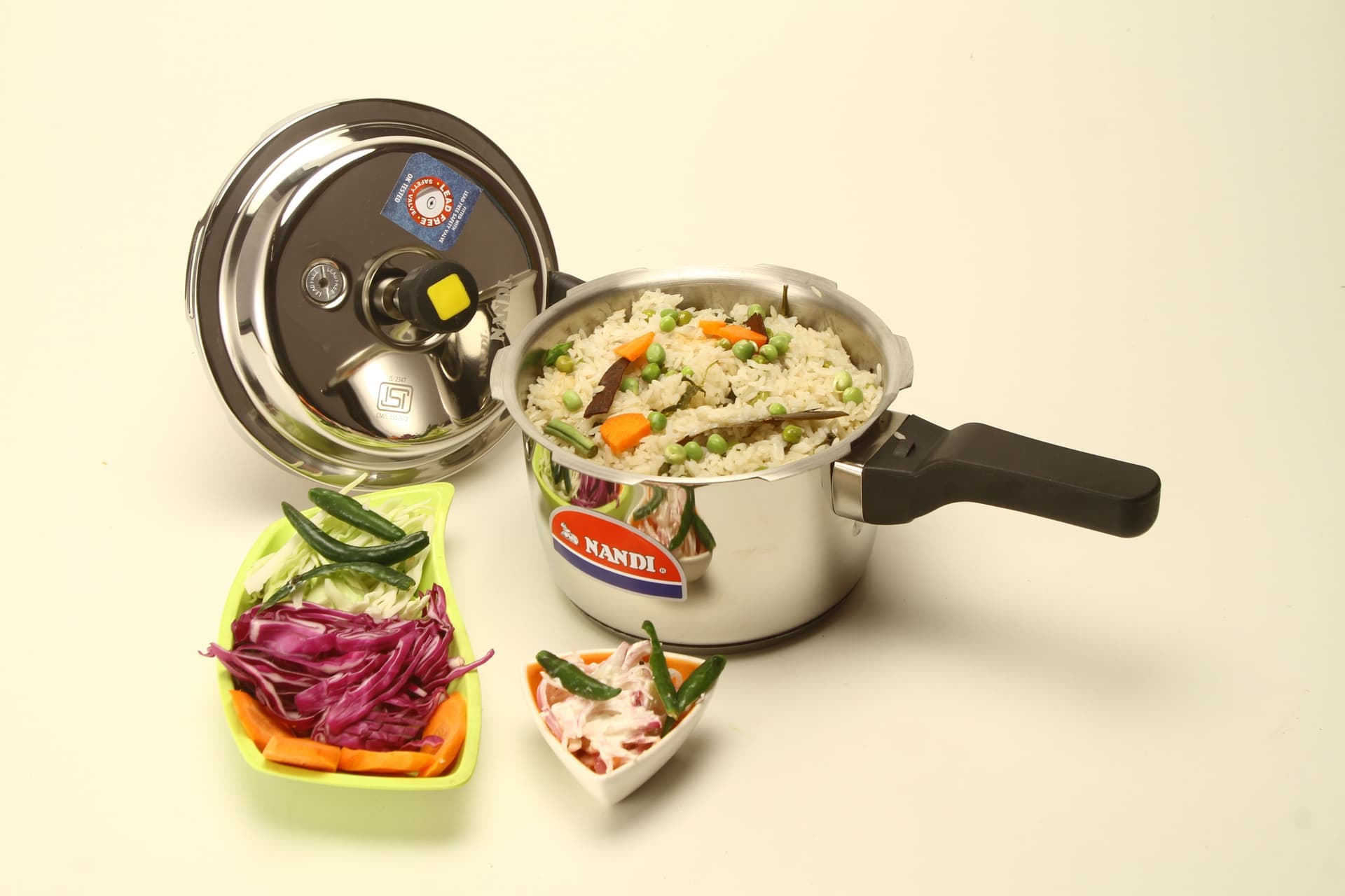 A stainless steel electric pressure cooker on a countertop