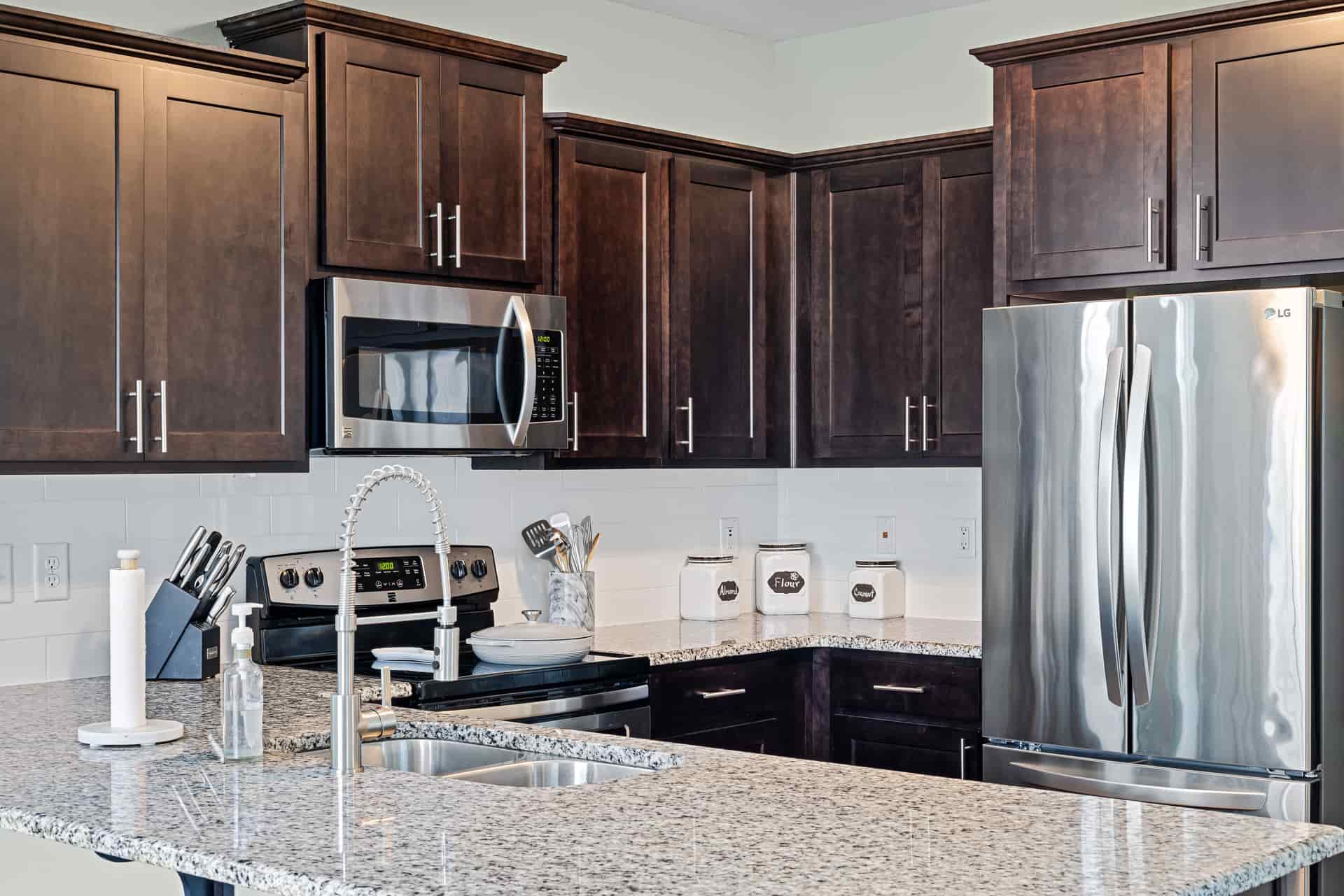 A modern kitchen with a cooktop and countertop appliances