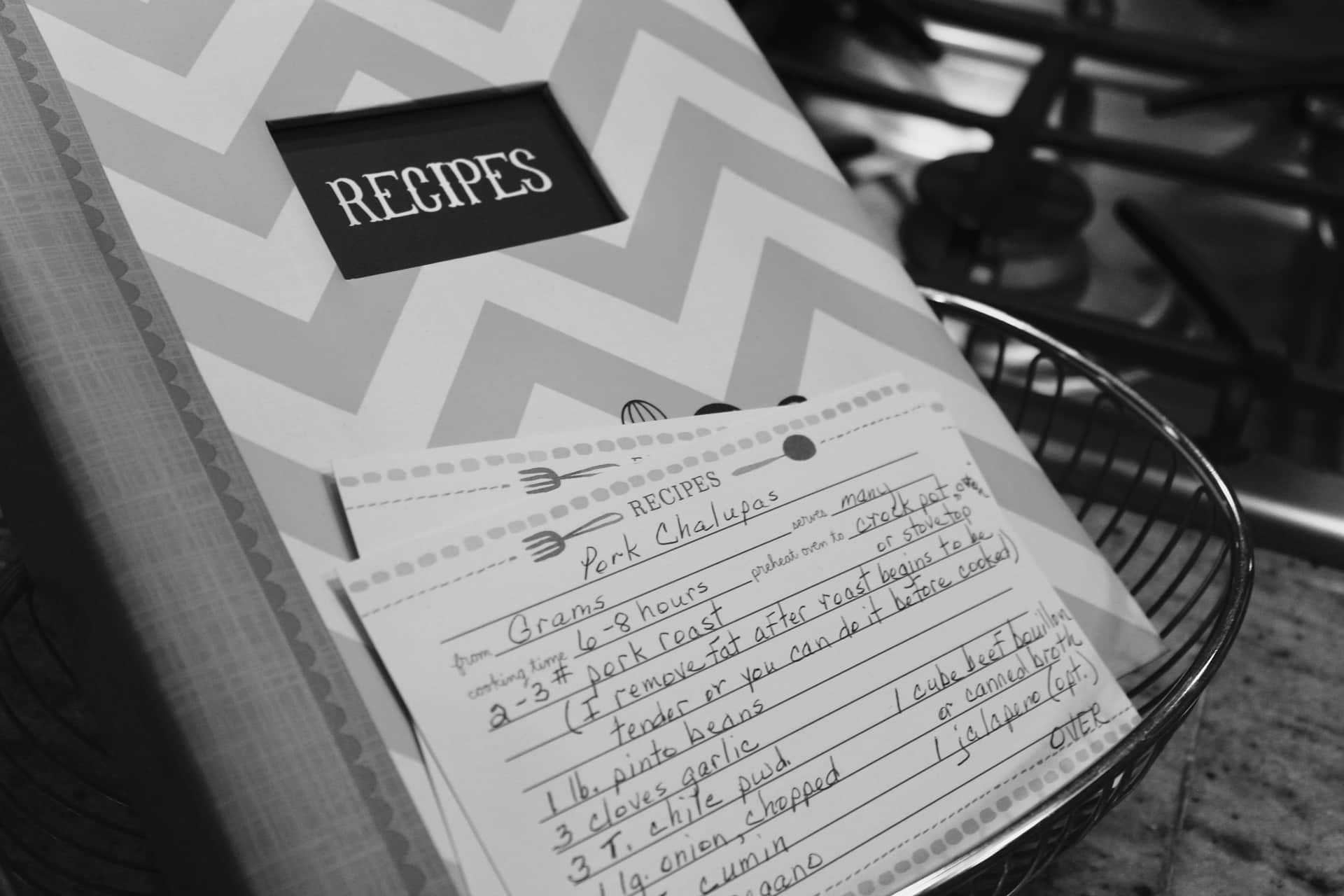 An open recipe book on a kitchen surface