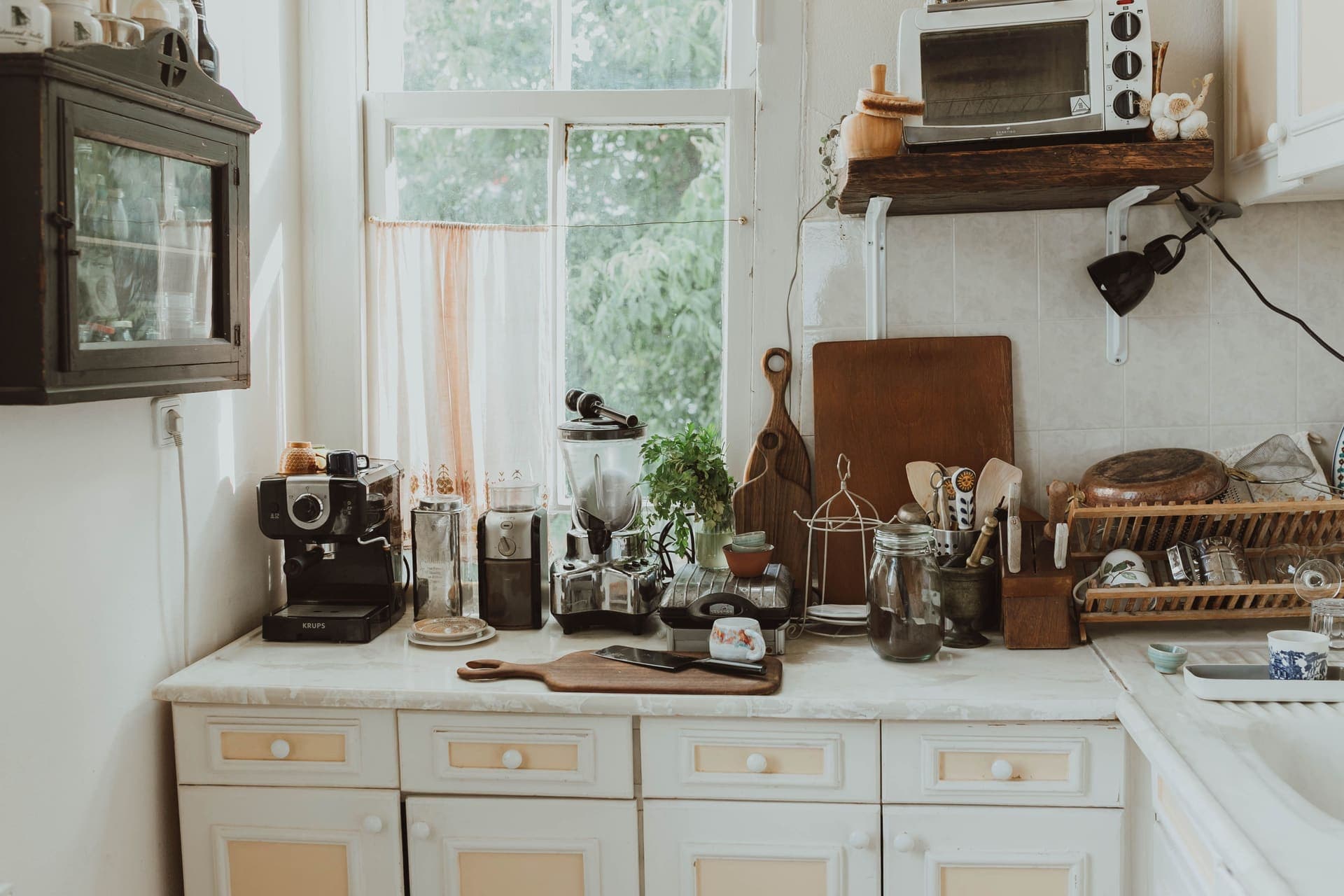 Glass jars of food beside a kitchen oven door