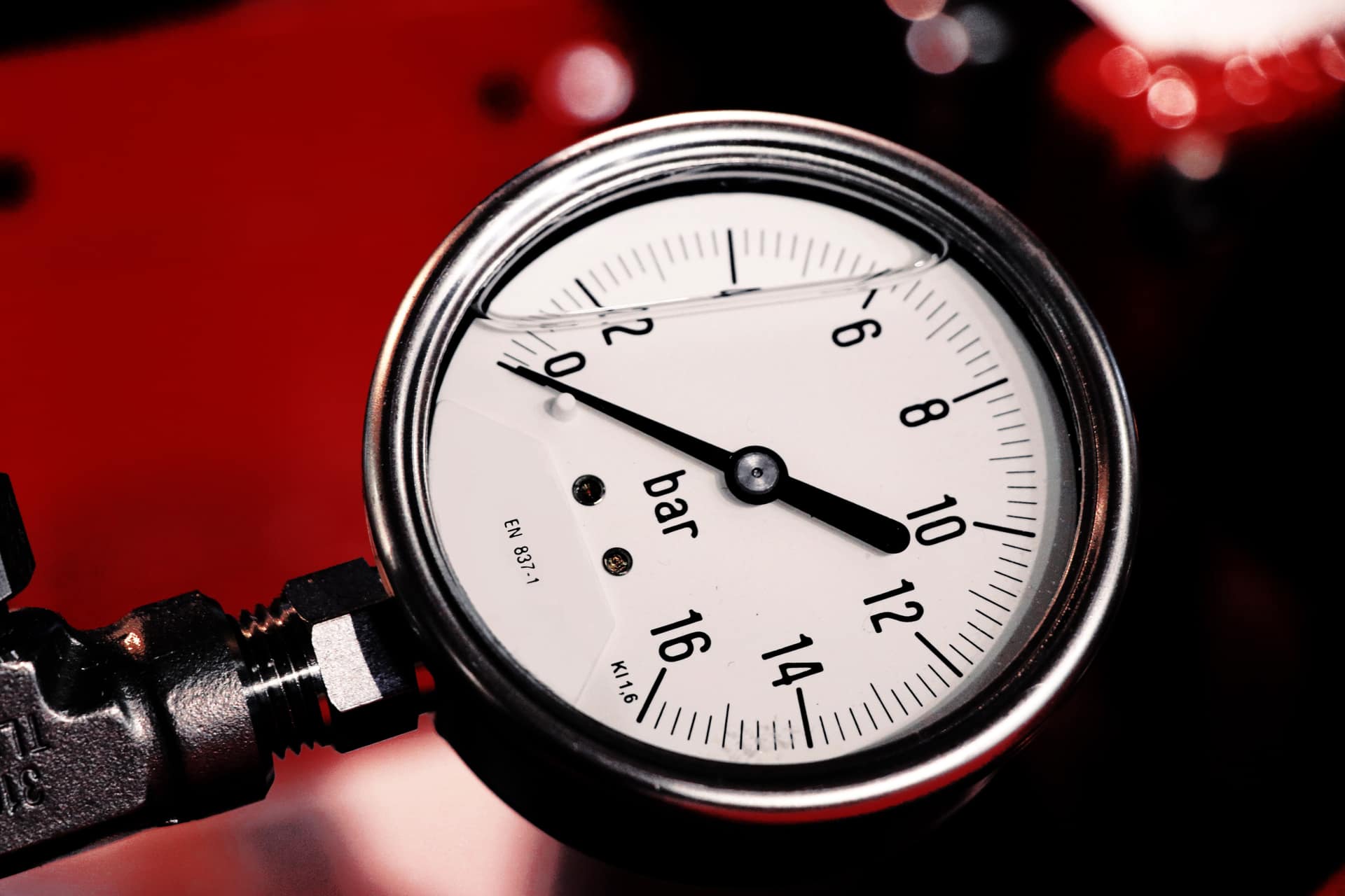 Close-up of a metal pressure gauge dial