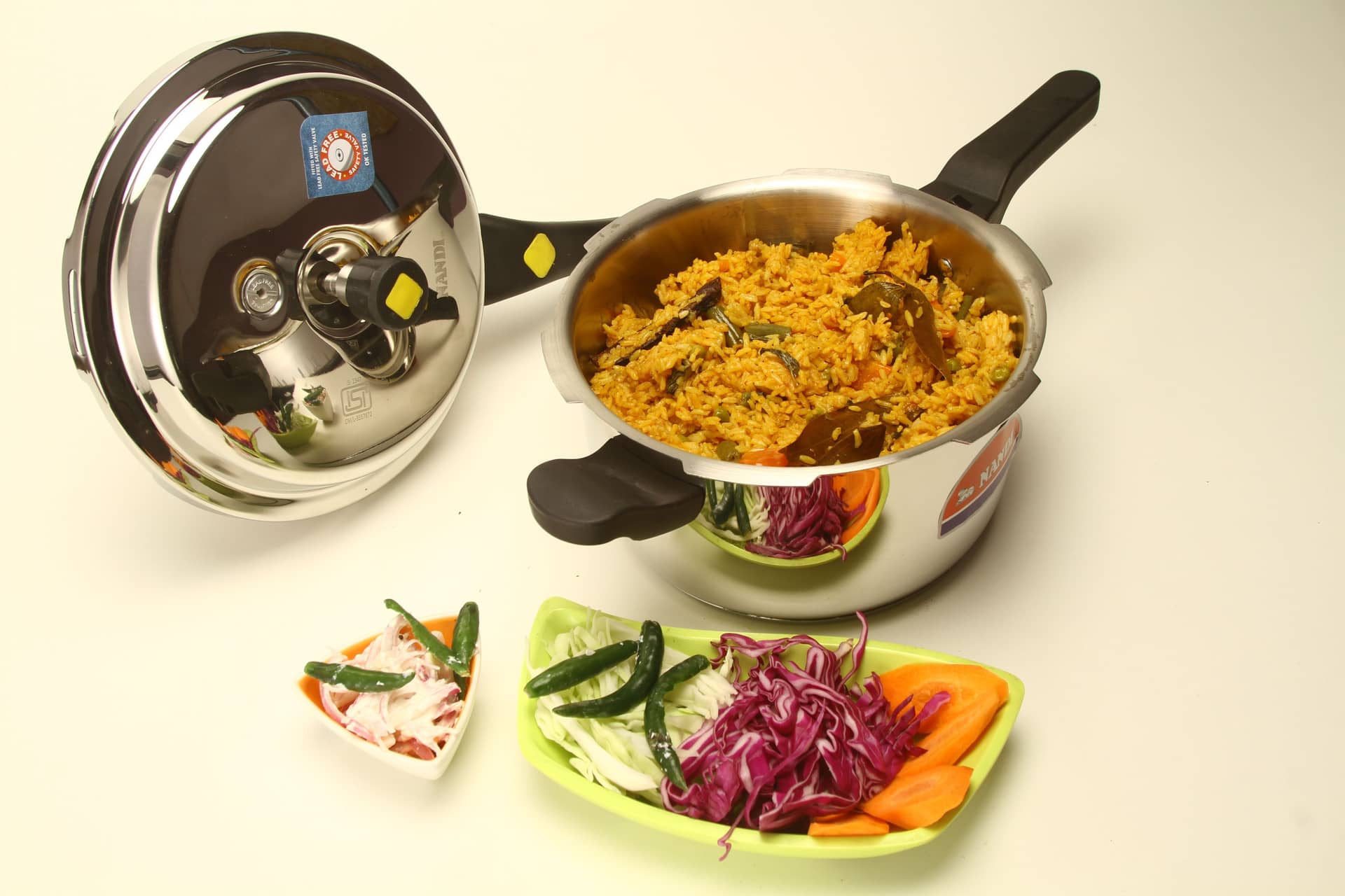 A pressure cooker on a kitchen counter with prepared food