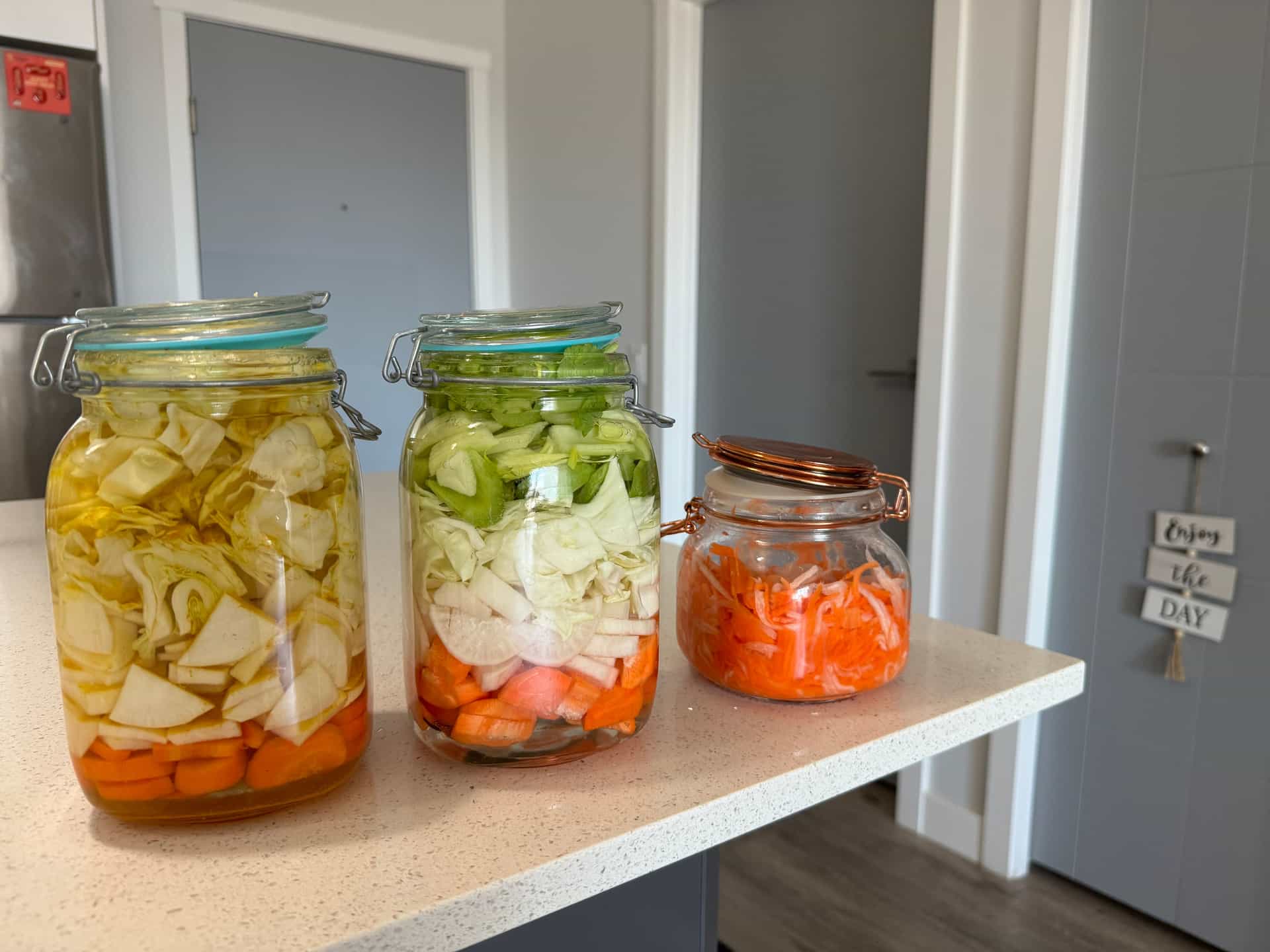 Colorful jars of home-preserved vegetables