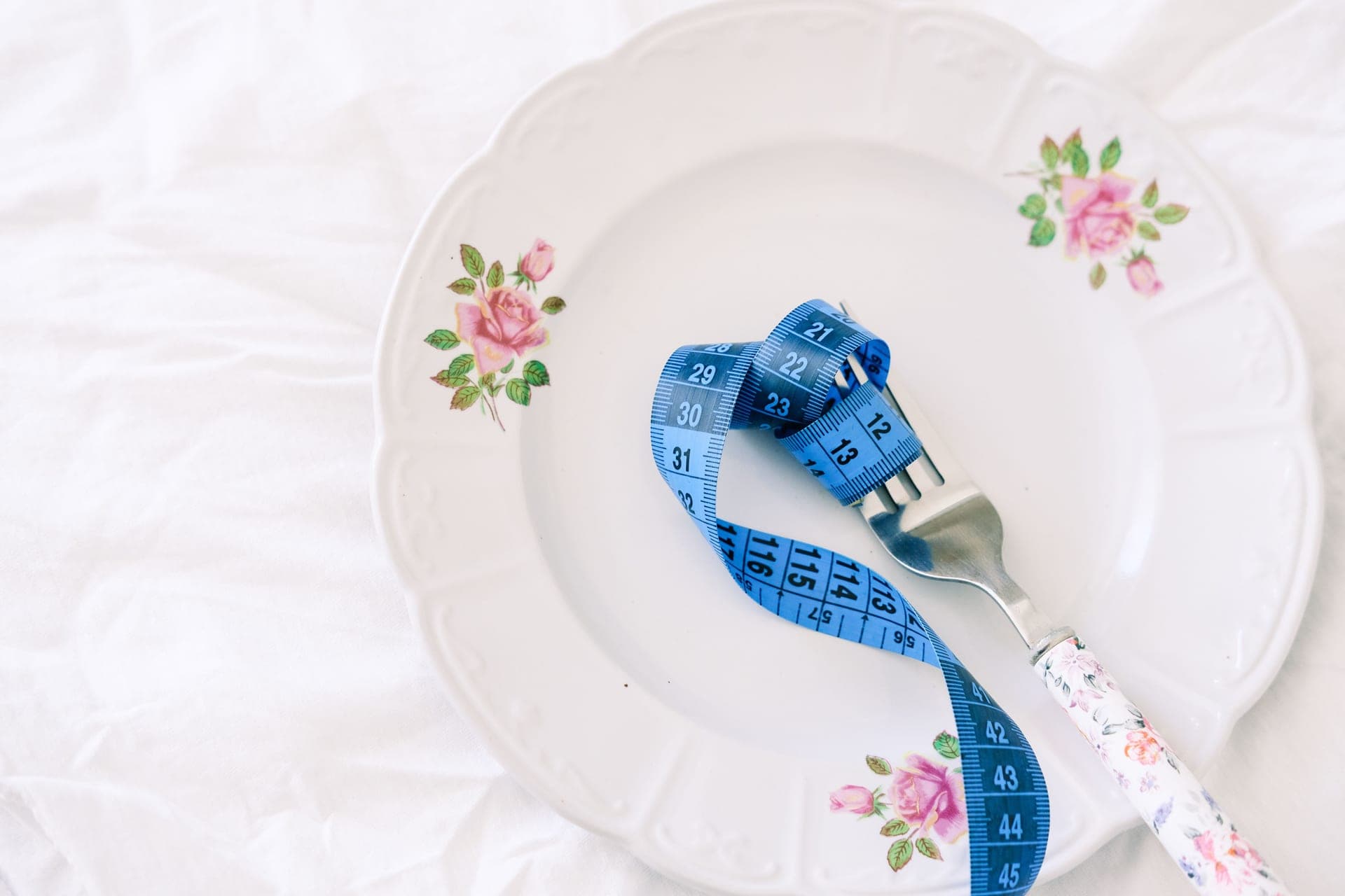 A measuring tape laid out on a kitchen surface