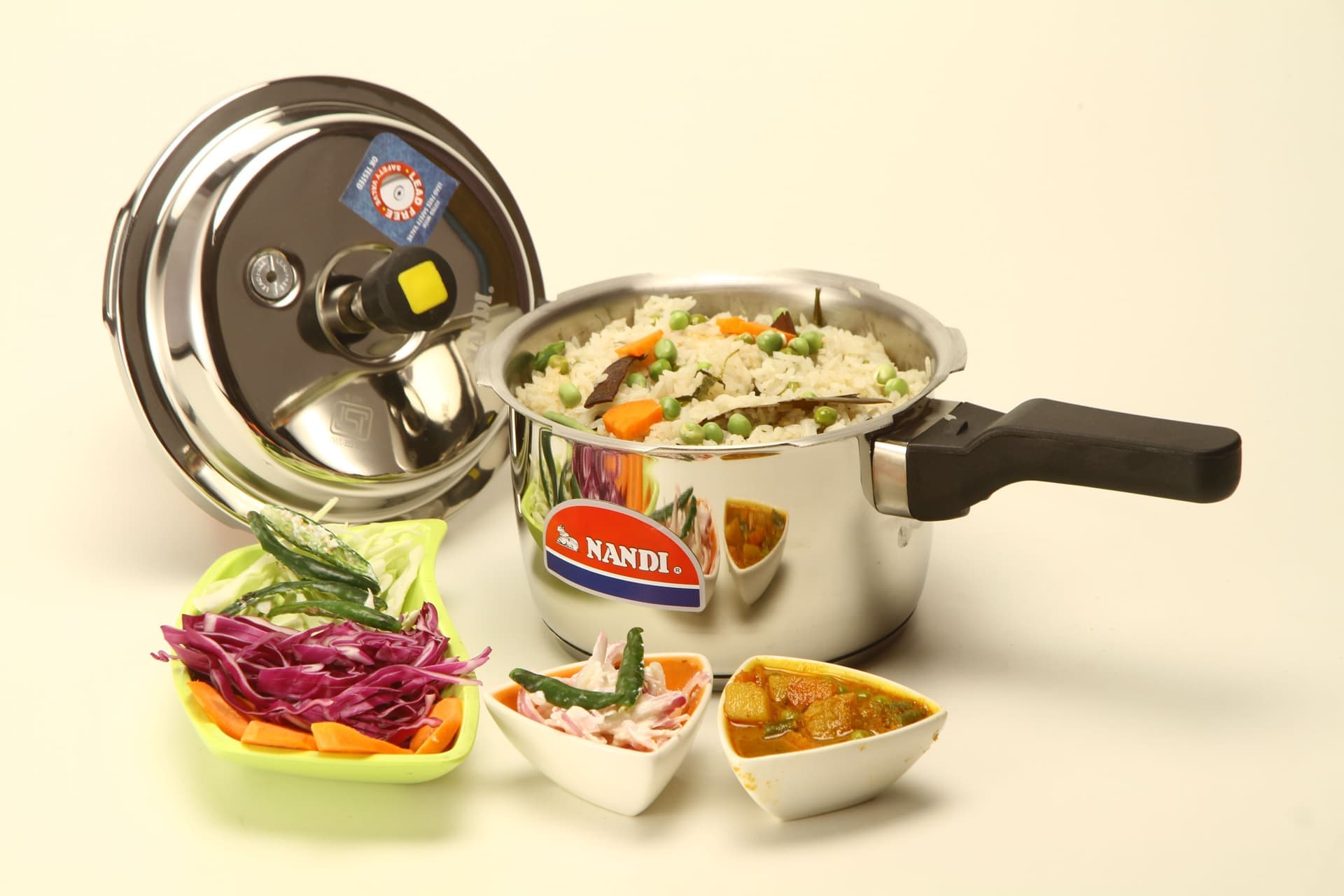 A stainless steel pressure canner on a kitchen surface